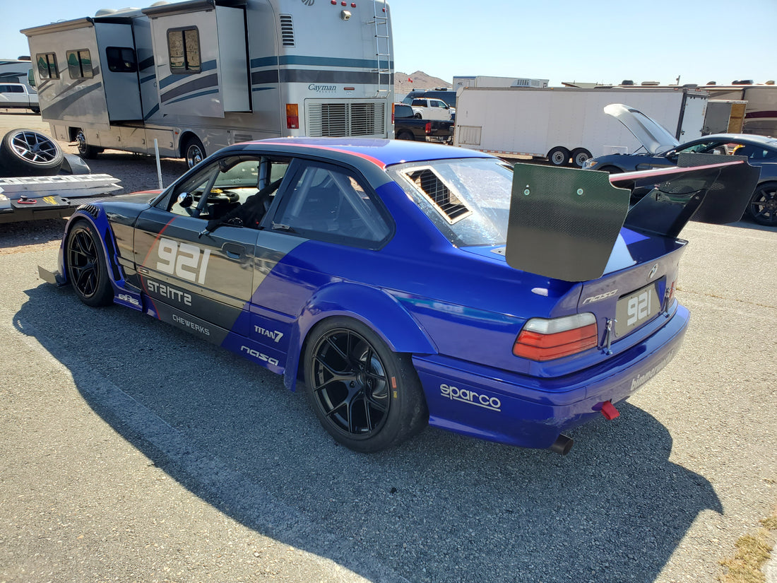 Blue BMW E36 race car with GT3-style rear window vents