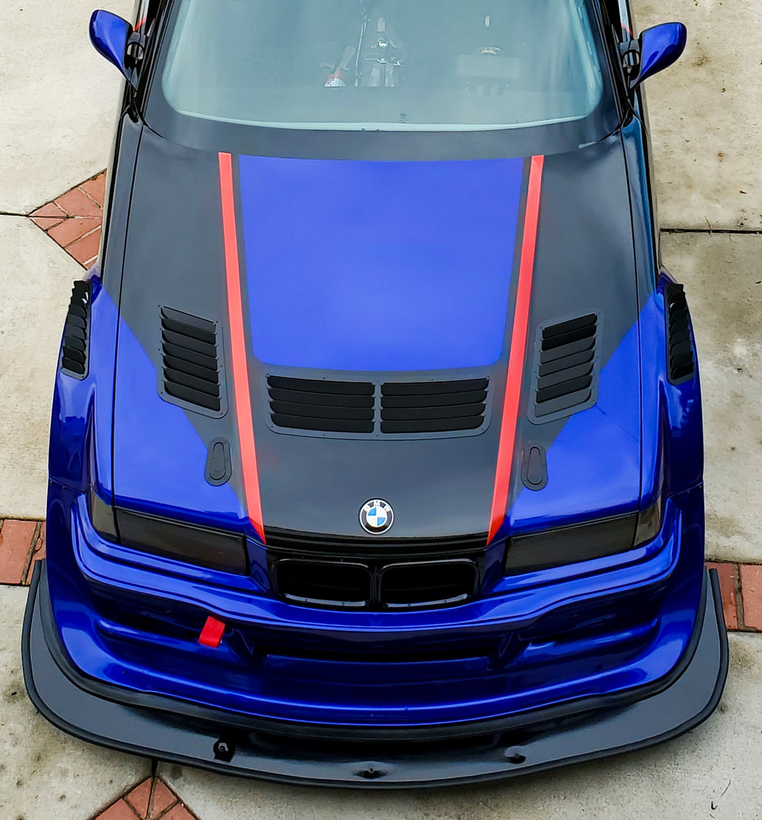 BMW E36 hood vents installed on our blue E36 race car, front view